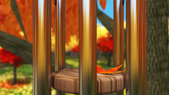 After the wind a single fallen leaf lies where it fell on a silent wind chime. On the ground beneath the still-green grass is covered with yellow and red leaves. In the background a crimson and gold autumn orchard reflects its colors in the silver bars of the chime.